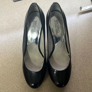 Size 9.5 Michael by Michael Kors platform heels. Worn once- too big for me.
